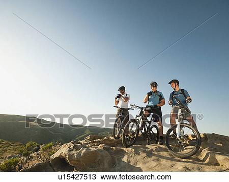 USA, California, Laguna Beach, Mountain bikers on top of hill View Large Photo Image Stock Image - USA, California, Laguna Beach, Mountain bikers on top of hill. Fotosearch