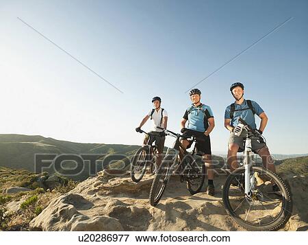USA, California, Laguna Beach, Mountain bikers on top of hill View Large Photo Image Stock Photo - USA, California, Laguna Beach, Mountain bikers on top of hill. Fotosearch
