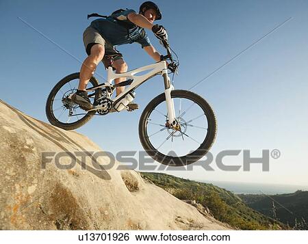USA, California, Laguna Beach, Mountain biker riding downhill View Large Photo Image Stock Photograph - USA, California, Laguna Beach, Mountain biker riding downhill. Fotosearch
