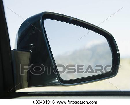 Stock Image - USA, California, Palm Springs, Coachella Valley, San Gorgonio Pass, Close up of rear- view mirror . Fotosearch