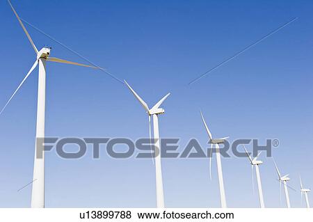 Stock Photo - USA, California, Palm Springs, Coachella Valley, San Gorgonio Pass, Wind turbines against blue sky. Fotosearch