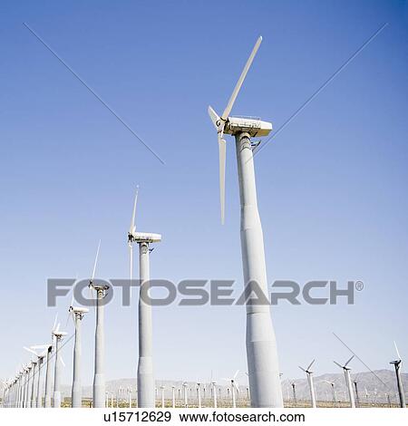 Stock Photo - USA, California, Palm Springs, Coachella Valley, San Gorgonio Pass, Wind turbines against blue sky. Fotosearch