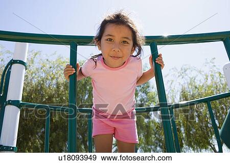 Stock Photo - USA, California, Portrait of girl (4-5) at playground. Fotosearch