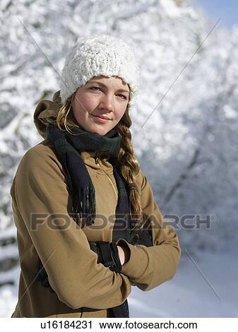 Stock Image - USA, Colorado, portrait of young woman in winter clothing. Fotosearch