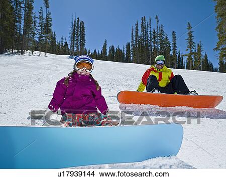 USA, Colorado, Telluride, Father and daughter (10-11) posing with snowboards in winter scenery View Large Photo Image Picture - USA, Colorado, Telluride, Father and daughter (10-11) posing with snowboards in winter scenery. Fotosearch