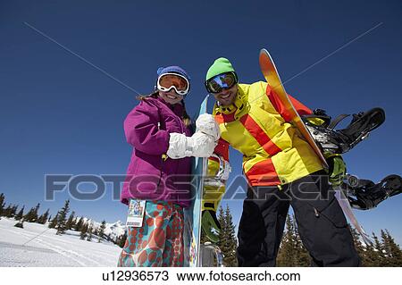 USA, Colorado, Telluride, Father and daughter (10-11) posing with snowboards in winter scenery View Large Photo Image Stock Image - USA, Colorado, Telluride, Father and daughter (10-11) posing with snowboards in winter scenery. Fotosearch