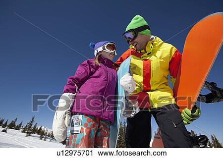 USA, Colorado, Telluride, Father and daughter (10-11) posing with snowboards in winter scenery View Large Photo Image Stock Image - USA, Colorado, Telluride, Father and daughter (10-11) posing with snowboards in winter scenery. Fotosearch