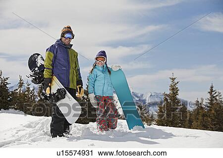 USA, Colorado, Telluride, Father and daughter (10-11) posing with snowboards in winter scenery View Large Photo Image Stock Image - USA, Colorado, Telluride, Father and daughter (10-11) posing with snowboards in winter scenery. Fotosearch