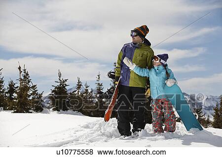 USA, Colorado, Telluride, Father and daughter (10-11) standing with snowboards in winter scenery View Large Photo Image Stock Photo - USA, Colorado, Telluride, Father and daughter (10-11) standing with snowboards in winter scenery. Fotosearch
