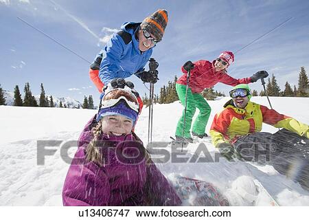 Stock Photo - USA, Colorado, Telluride, Three-generation family with girl (10-11) during ski holiday. Fotosearch