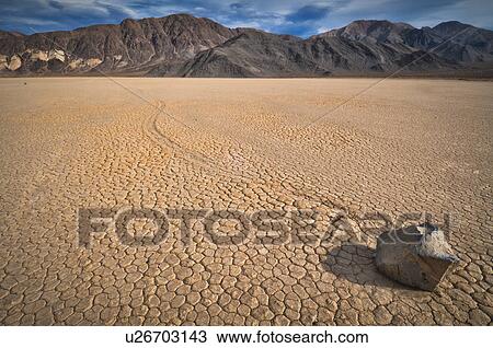 Stock Image - USA, Death Valley, Rock on Playa. Fotosearch