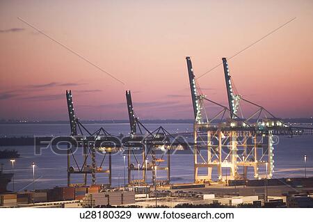 Stock Photo - USA, Florida, Miami, Commercial dock at dusk. Fotosearch