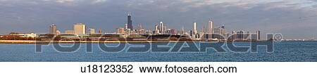 Stock Image - USA, Illinois, Chicago, City skyline over Lake Michigan. Fotosearch