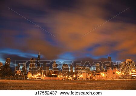 Stock Photo - USA, Illinois, Chicago, City skyline over Lake Michigan. Fotosearch