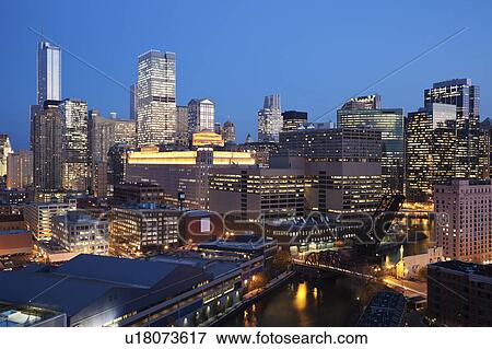 USA, Illinois, Chicago, Skyline and river illuminated at night View Large Photo Image Stock Photo - USA, Illinois, Chicago, Skyline and river illuminated at night. Fotosearch