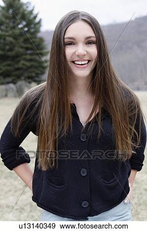 Stock Photo - USA, New Jersey, Califon, Portrait of young smiling teenage girl (16-17). Fotosearch