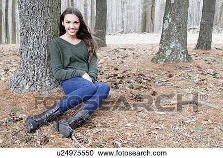USA, New Jersey, Califon, Teenage girl (16-17) sitting in forest, portrait View Large Photo Image Stock Image - USA, New Jersey, Califon, Teenage girl (16-17) sitting in forest, portrait. Fotosearch