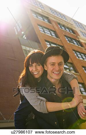 Stock Photo - USA, New Jersey, Jersey City, portrait of young couple. Fotosearch