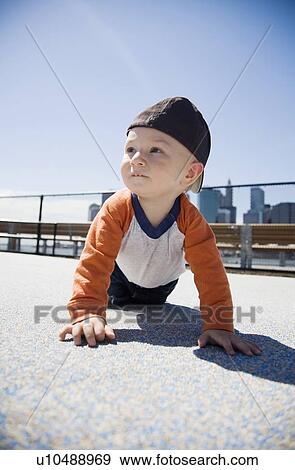 USA, New York City, Brooklyn, baby boy (0-1 years) crawling on sidewalk View Large Photo Image Stock Photo - USA, New York City, Brooklyn, baby boy (0-1 years) crawling on sidewalk. Fotosearch