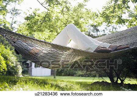 USA, New York State, Long Island, woman relaxing in hammock View Large Photo Image Stock Photograph - USA, New York State, Long Island, woman relaxing in hammock. Fotosearch