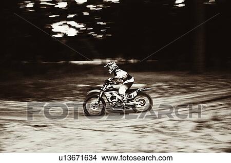 USA, Texas, Austin, Cross motorcyclist on sandy track View Large Photo Image Picture - USA, Texas, Austin, Cross motorcyclist on sandy track. Fotosearch