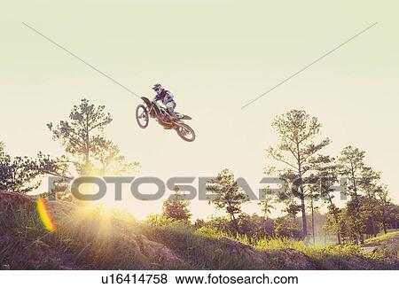 USA, Texas, Austin, Dirt bike jumping View Large Photo Image Stock Photo - USA, Texas, Austin, Dirt bike jumping. Fotosearch