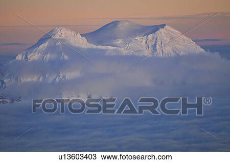 USA, Washington State, Mount Rainier peak in clouds View Large Photo Image Stock Image - USA, Washington State, Mount Rainier peak in clouds. Fotosearch