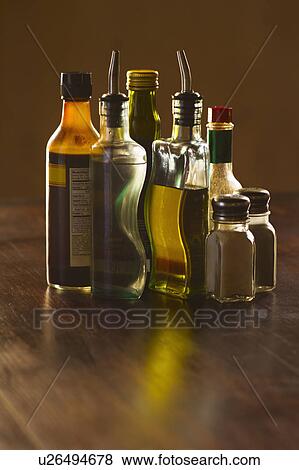 Variety of spices on table View Large Photo Image Stock Photo - Variety of spices on table. Fotosearch