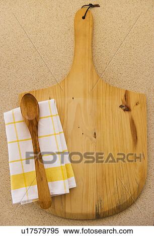 Wooden chopping board, spoon ad checked napkin View Large Photo Image Stock Photography - Wooden chopping board, spoon ad checked napkin. Fotosearch