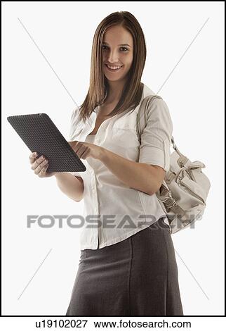 Stock Photo - Young attractive businesswoman holding file. Fotosearch