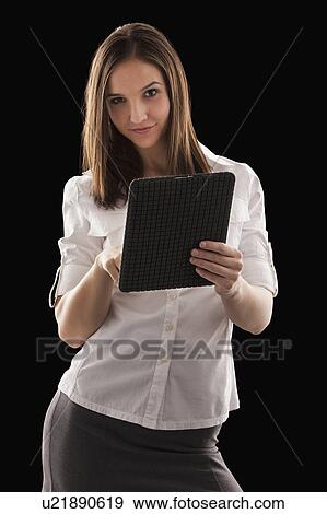 Stock Photo - Young attractive businesswoman holding file. Fotosearch