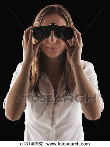 Young attractive businesswoman looking through binoculars View Large Photo Image Stock Image - Young attractive businesswoman looking through binoculars. Fotosearch