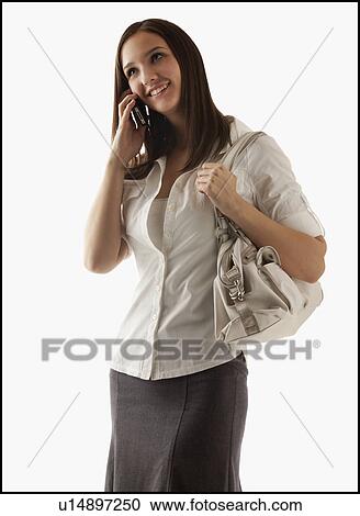 Stock Image - Young attractive businesswoman using mobile phone. Fotosearch