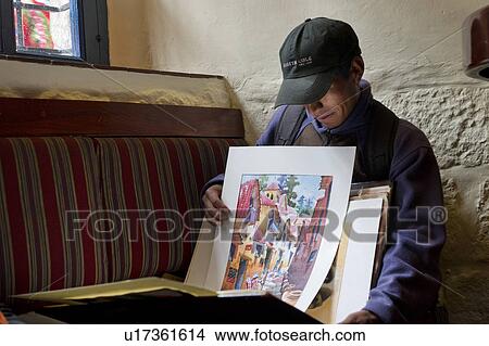 Artist showing his paintings, Cuzco, Peru View Large Photo Image Picture - Artist showing his paintings, Cuzco, Peru. Fotosearch