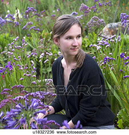 Stock Photograph - Close-up of a woman in the garden of Willka Tika Guesthouse, Willka Tika, Sacred Valley, Cusco Region, Peru. Fotosearch
