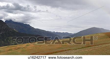 Stock Photo - Clouds over a mountain range, Sacred Valley, Cusco Region, Peru. Fotosearch