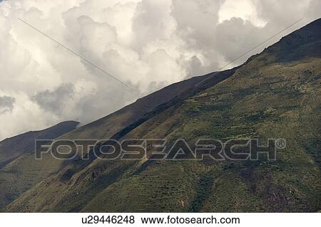 Clouds over a mountain range, Sacred Valley, Cusco Region, Peru View Large Photo Image Stock Photo - Clouds over a mountain range, Sacred Valley, Cusco Region, Peru. Fotosearch