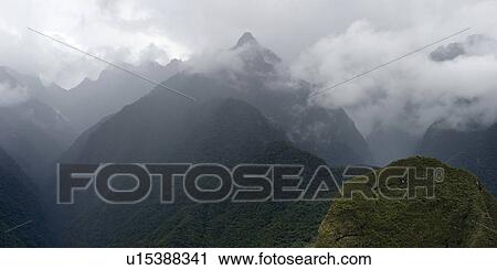 Clouds over mountains, Machu Picchu, Cusco Region, Peru View Large Photo Image Stock Image - Clouds over mountains, Machu Picchu, Cusco Region, Peru. Fotosearch
