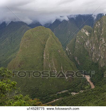 Clouds over mountains, Machu Picchu, Cusco Region, Peru View Large Photo Image Stock Photography - Clouds over mountains, Machu Picchu, Cusco Region, Peru. Fotosearch