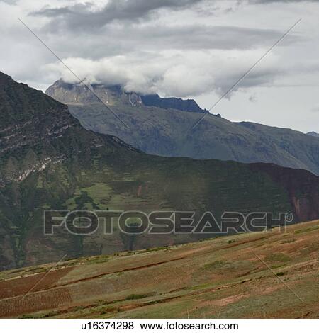 Stock Photo - Clouds over mountains, Sacred Valley, Cusco Region, Peru. Fotosearch