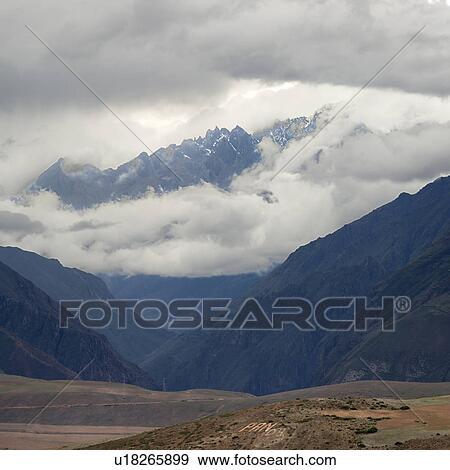 Clouds over mountains, Sacred Valley, Cusco Region, Peru View Large Photo Image Stock Photo - Clouds over mountains, Sacred Valley, Cusco Region, Peru. Fotosearch
