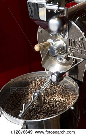 Stock Photo - Coffee beans in a coffee grinder, Cuzco, Peru. Fotosearch