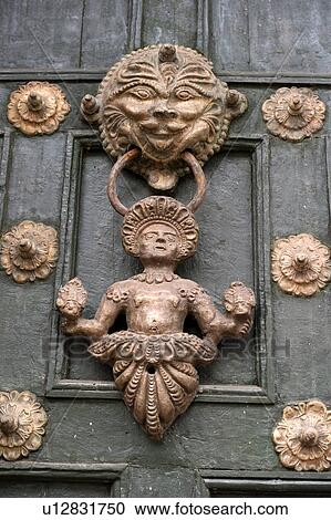 Stock Image - Door knocker of a door, Cuzco, Peru. Fotosearch
