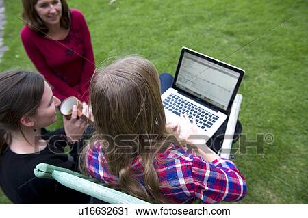 Family looking at a laptop in the lawn of Willka Tika Guesthouse, Willka Tika, Sacred Valley, Cusco Region, Peru View Large Photo Image Stock Image - Family looking at a laptop in the lawn of Willka Tika Guesthouse, Willka Tika, Sacred Valley, Cusco Region, Peru. Fotosearch