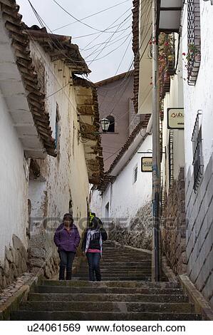 Female friend moving down a stepped walkway in Cuzco, Peru View Large Photo Image Stock Photo - Female friend moving down a stepped walkway in Cuzco, Peru. Fotosearch