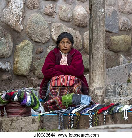Picture - Female street vendor selling traditional cloths, Cuzco, Peru. Fotosearch