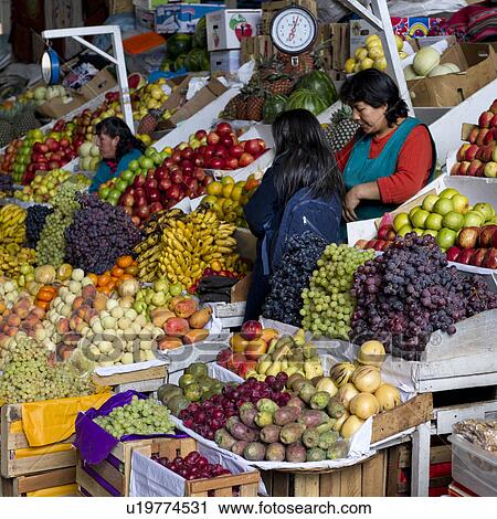 Stock Image - Fruits at a market stall, Mercado Central, Cuzco, Peru. Fotosearch