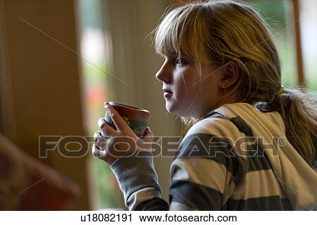 Girl drinking hot chocolate in Willka Tika Guesthouse, Willka Tika, Sacred Valley, Cusco Region, Peru View Large Photo Image Stock Image - Girl drinking hot chocolate in Willka Tika Guesthouse, Willka Tika, Sacred Valley, Cusco Region, Peru. Fotosearch
