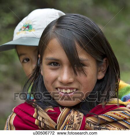 Girl giving piggyback to her sister and smiling, Sacred Valley, Cusco Region, Peru View Large Photo Image Stock Image - Girl giving piggyback to her sister and smiling, Sacred Valley, Cusco Region, Peru. Fotosearch