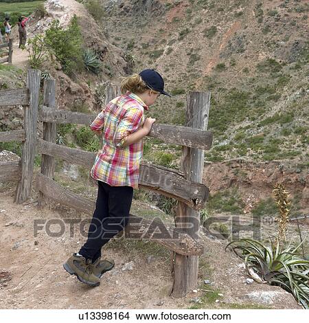 Girl looking at valley view in Sacred Valley, Cusco Region, Peru View Large Photo Image Picture - Girl looking at valley view in Sacred Valley, Cusco Region, Peru. Fotosearch